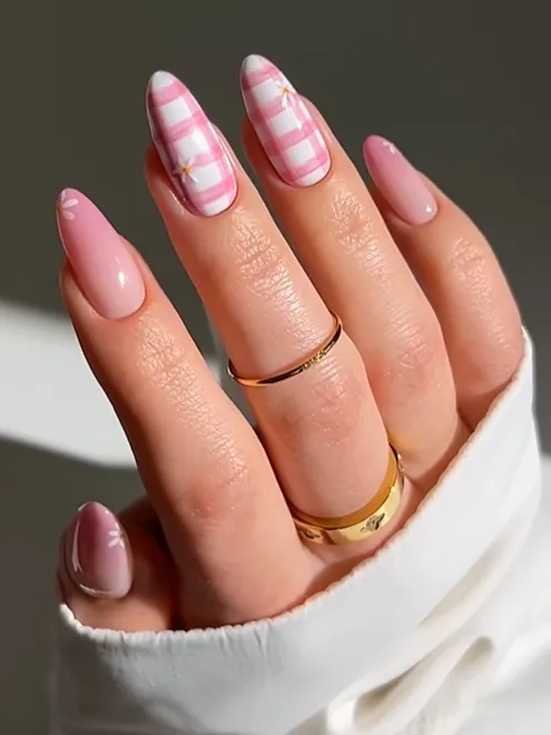 Pink Plaid Nail Designs Pink plaid acrylic nails with glossy blush polish and gingham nail art design, featuring soft feminine almond-shaped nails and trendy cute manicure inspiration.
